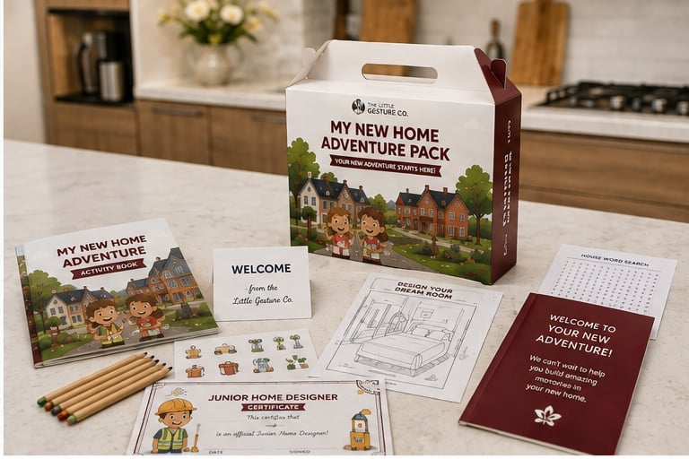 The My New Home Adventure pack and its contents on a kitchen counter, with welcome card, puzzle, colouring pages and guidebook